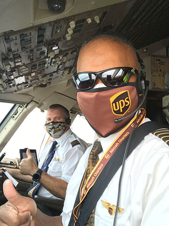 Houston Mills (front) 85, and Vice President of Flight Operations for UPS, with co-pilot Neal Newell.